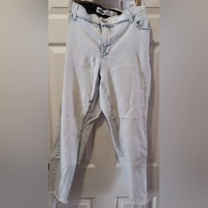 Distressed faded blue jeans